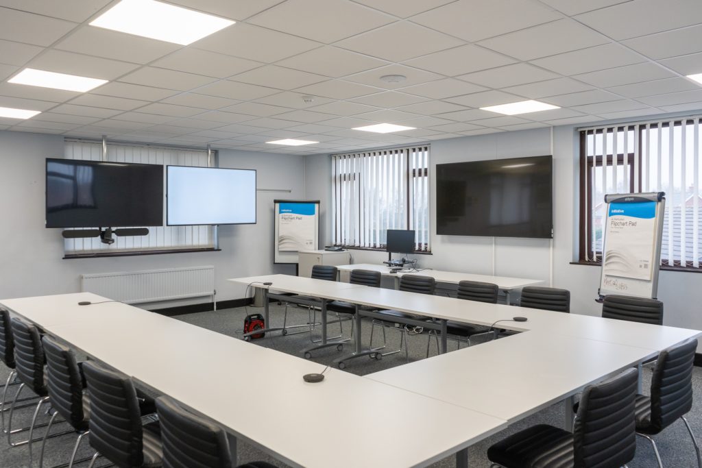 room with tables and screens